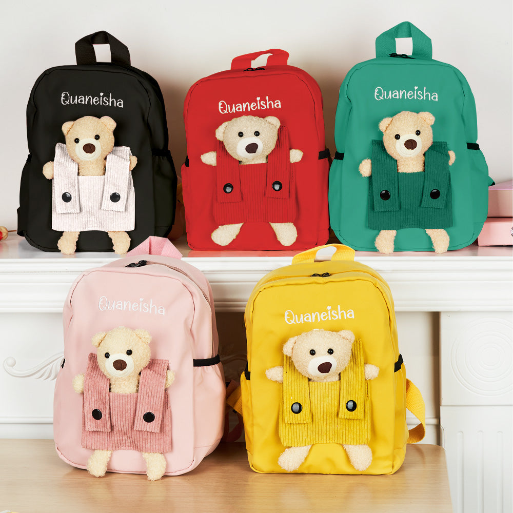 Scale comparison of the personalised name embroidery bear backpack with a water bottle and toys — compact 21×27×10cm size for preschoolers