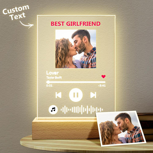 Personalised acrylic music plaque with engraved scannable song code, custom photo and matching photo keychain beside LED night light holder