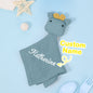 Close up of embroidered name on personalised cotton comforter, soft texture of custom baby lovey