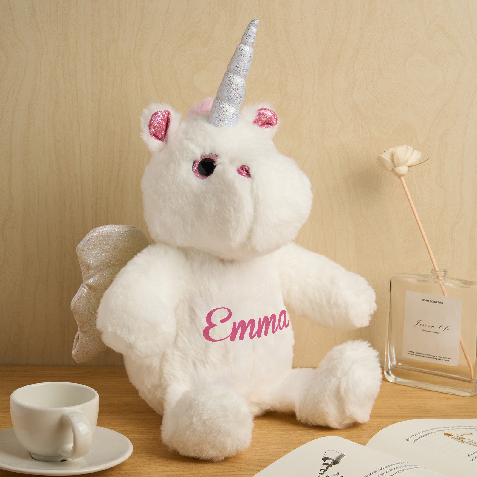Personalised unicorn plush displayed on a nursery shelf as a birth announcement teddy and keepsake gift for new parents