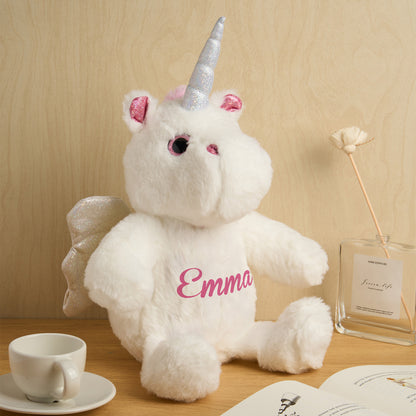 Personalised unicorn plush displayed on a nursery shelf as a birth announcement teddy and keepsake gift for new parents