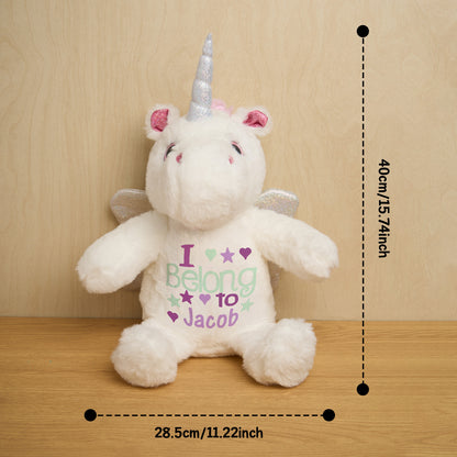 Personalised unicorn plush beside a measuring reference to show dimensions, custom baby name soft toy and nursery decor item
