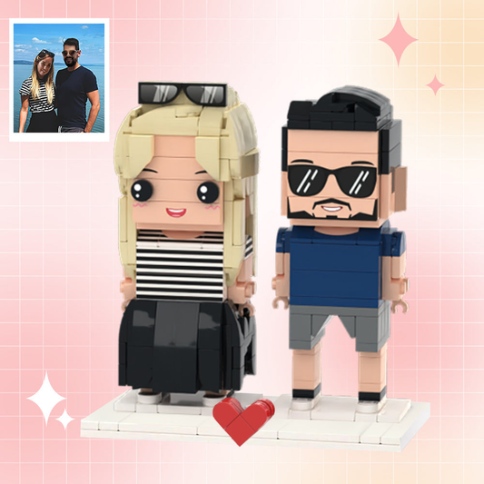 Personalised seaside custom brick figures for couples featuring two miniature ABS figures in summer outfits on a beach display – perfect personalised seaside vacation gift