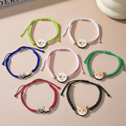 Wooden pendant with pet portrait and braided cord detail on bracelet
