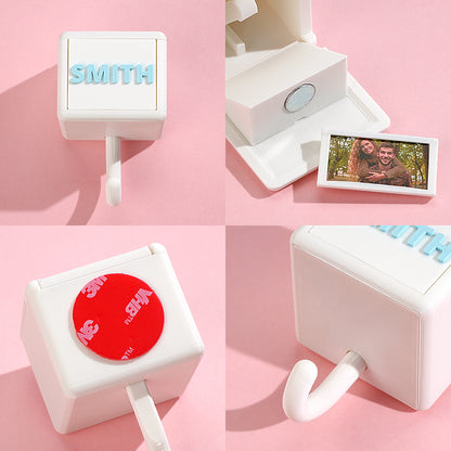 Gallery of personalised 3D printed gravity hooks mounted on a hallway wall holding keys and coats — stylish, practical home decor and ideal housewarming or teacher gift