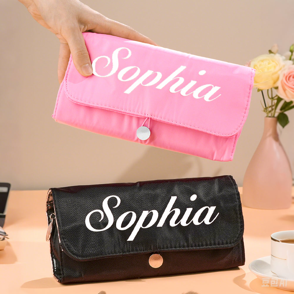 Detail of zip and stitching on personalised birth flower make-up brush bag, showing durable nylon construction and neat custom print