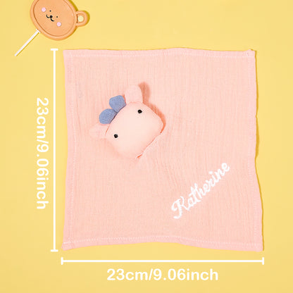 Personalised baby comforter with embroidered name beside dummy and toy, ideal small comfort blanket for cot and car seat