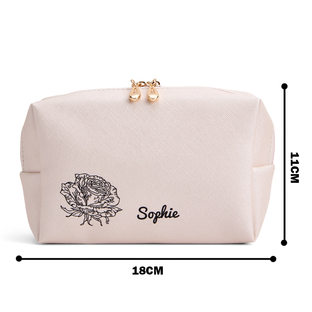 Close-up of soft leather texture and printed birth flower motif on personalised make-up bag, showing quality finish and durable zip