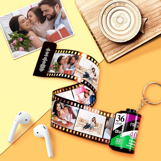 Green personalised scannable music code photo film roll keyring showing film-strip photos and the scannable music code on the film head