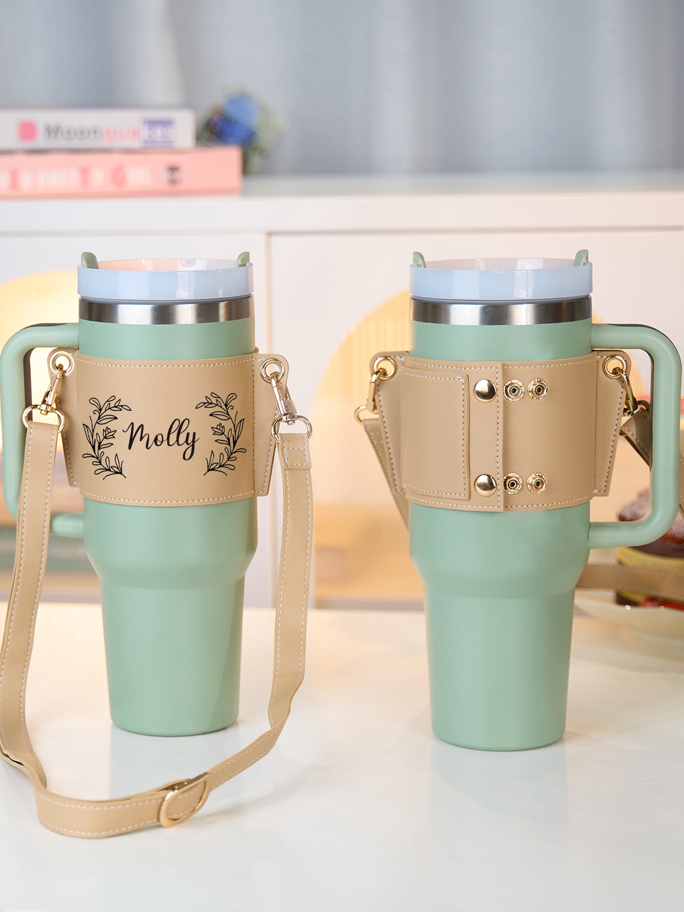 Compatibility demonstration showing a 40oz Stanley tumbler in the personalised floral PU carrier — fits most 40oz insulated bottles