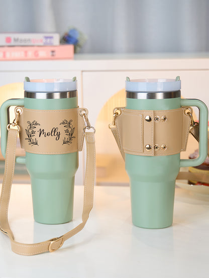 Compatibility demonstration showing a 40oz Stanley tumbler in the personalised floral PU carrier — fits most 40oz insulated bottles