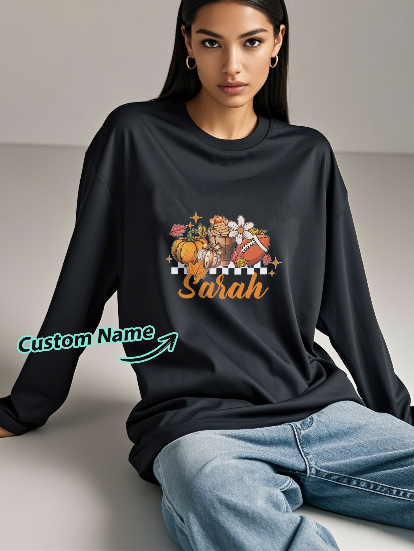Close-up of custom engraved name on personalised Halloween long-sleeve T-shirt showing crisp print detail