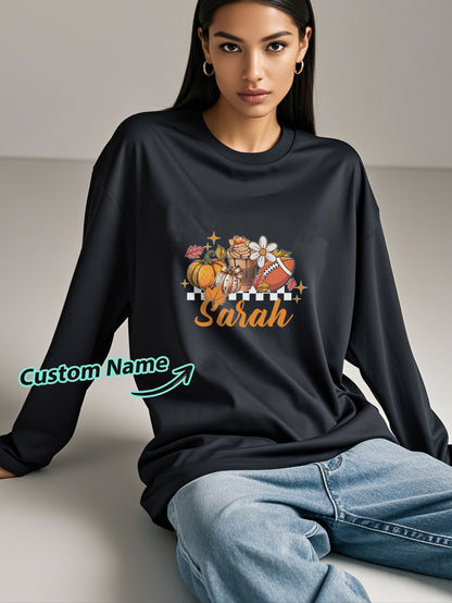 Close-up of custom engraved name on personalised Halloween long-sleeve T-shirt showing crisp print detail