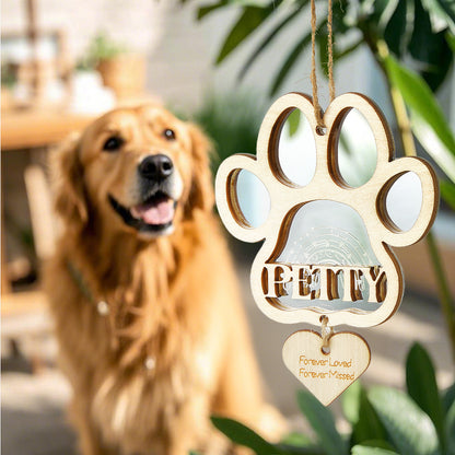 Personalised dog paw memorial ornament hanging on a decorated Christmas tree, bespoke pet loss gift for grieving pet owners