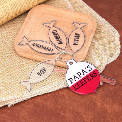 Close-up of custom printed text on glossy acrylic fishing rod keyring — personalised keepsake for Father's Day or birthday
