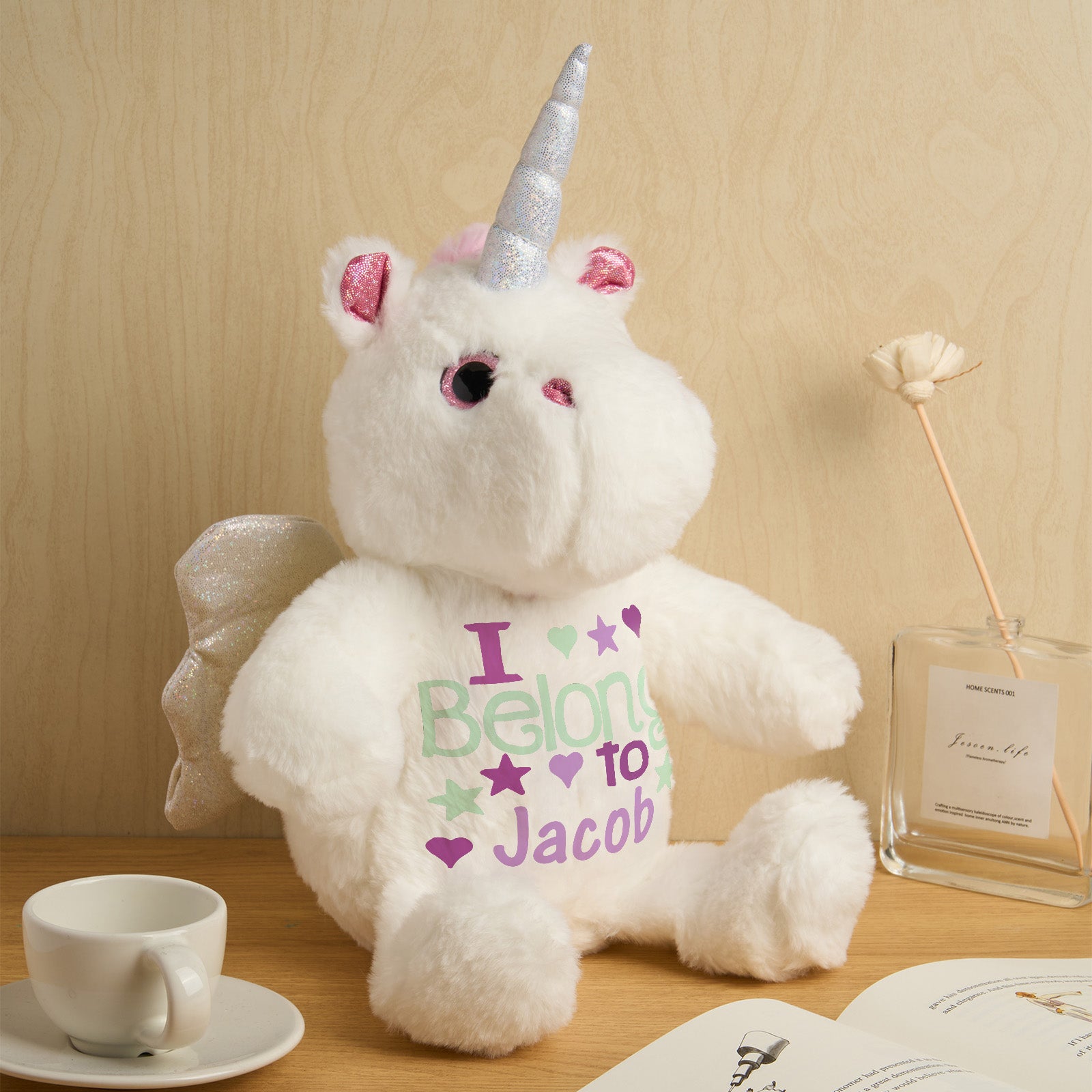 Detailed close-up showing plush fabric, embroidered text and stitching of the personalised unicorn birth announcement teddy