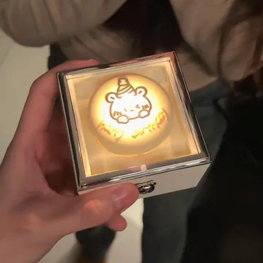 Bear Cake Ring Box in copper with flickering candlelight and rotating ring reveal — elegant surprise ring gift for her