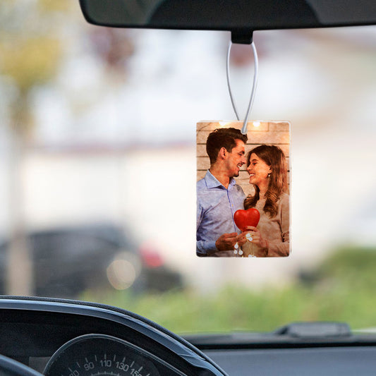 Custom photo car air freshener featuring a personalised couple portrait on soft felt with a heat-transfer print, rectangle 10x7 cm.