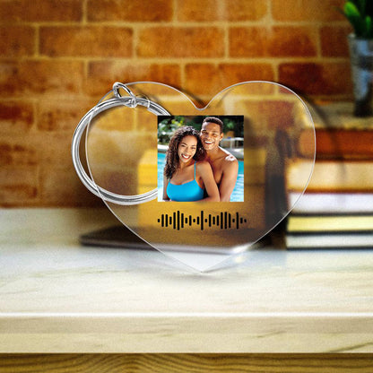 Lifestyle image of personalised music keyring attached to keys and a handbag, featuring sturdy metal ring and clear acrylic design