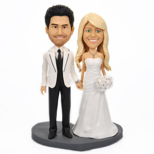 Personalised sweet wedding bobblehead with engraved base – handcrafted polymer clay bride and groom keepsake, customised head sculpt and short-hair bobble option, ideal personalised wedding gift or cake topper