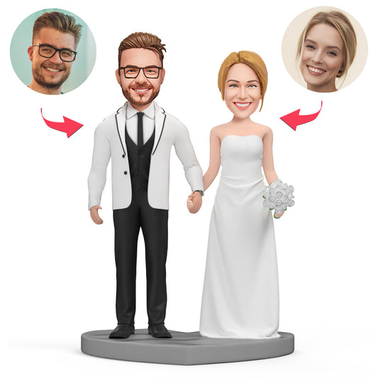 Personalised sweet wedding bobblehead with engraved base – handcrafted polymer clay bride and groom keepsake, customised head sculpt and short-hair bobble option, ideal personalised wedding gift or cake topper