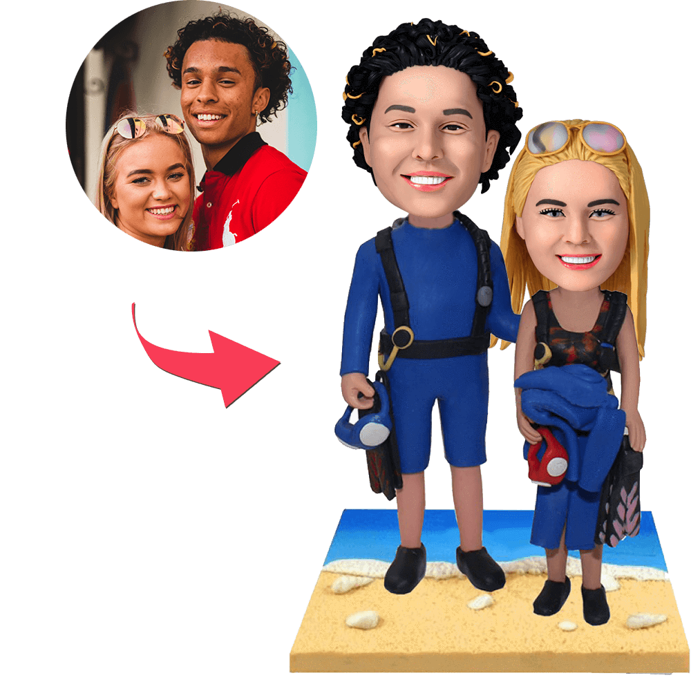 Wetsuit beach couple custom bobblehead — hand-crafted personalised polymer clay figurines in wetsuits with engraved base