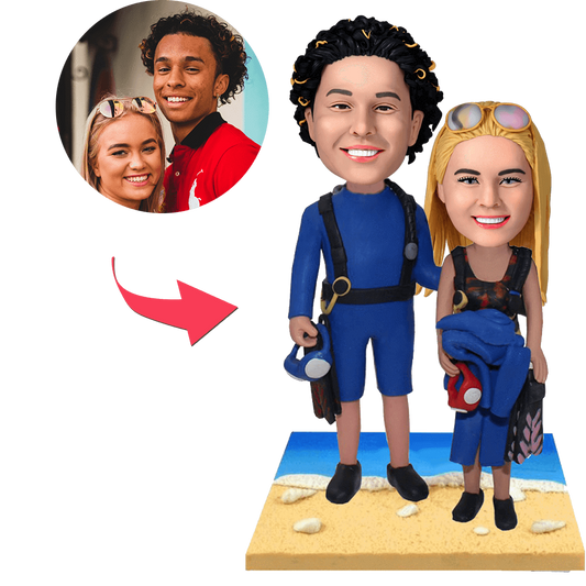 Wetsuit beach couple custom bobblehead — hand-crafted personalised polymer clay figurines in wetsuits with engraved base