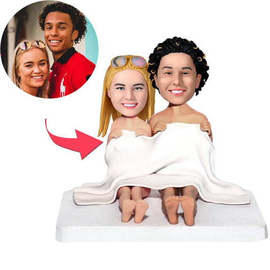 Personalised blanket couples bobblehead in polymer clay, two figures sharing a blanket with engraved text on the base – custom bobblehead gift, personalised gift Australia