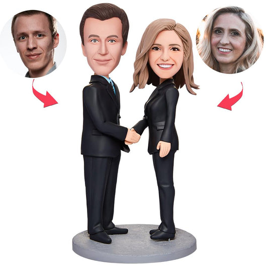 Personalised business bobblehead in polymer clay on white background — customised head likeness with fixed suit body and engraved base, ideal corporate desk gift and office keepsake