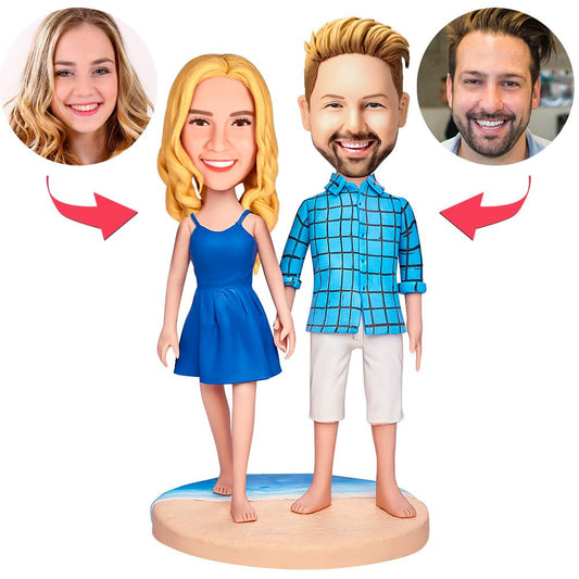 Personalised polymer clay couple honeymoon bobbleheads on a sandy beach base with engraved text — custom honeymoon bobblehead and engraved couple keepsake