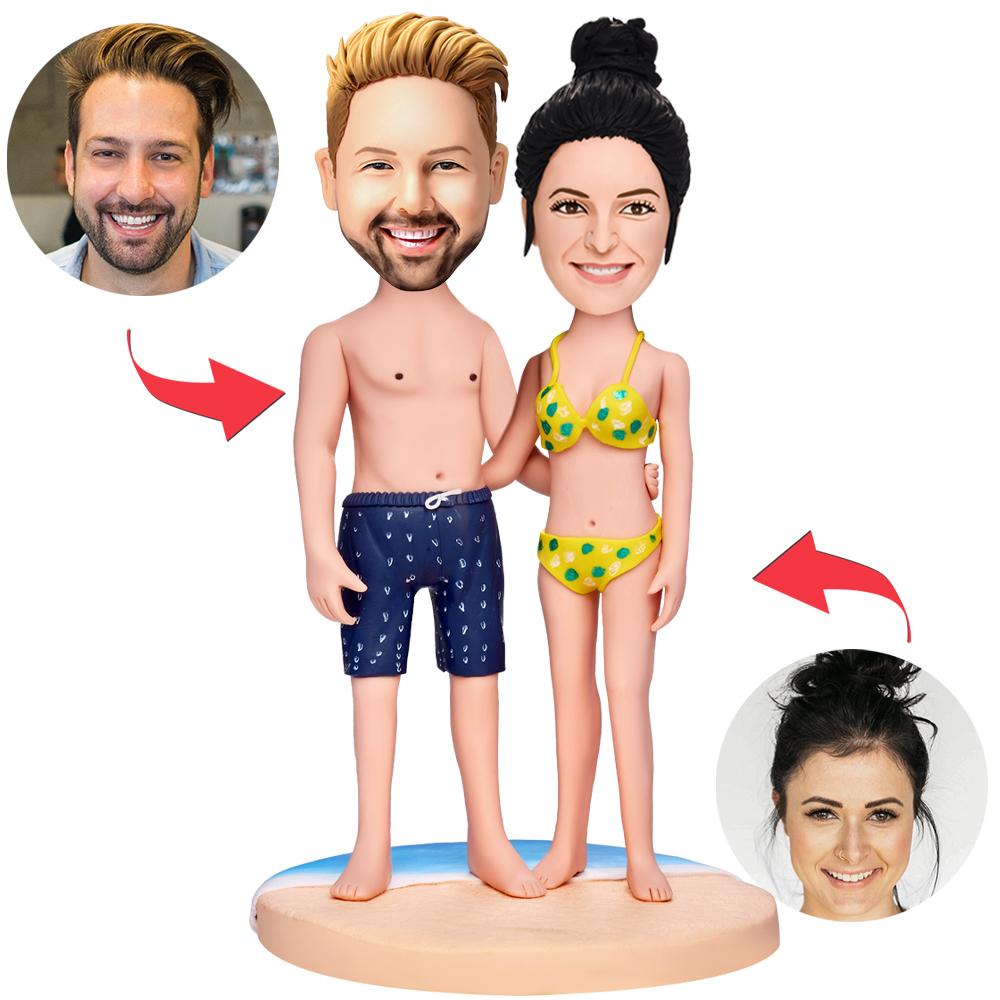Personalised polymer-clay couple bikini bobbleheads with custom heads from photos and engraved base text — perfect beach, wedding or anniversary gift