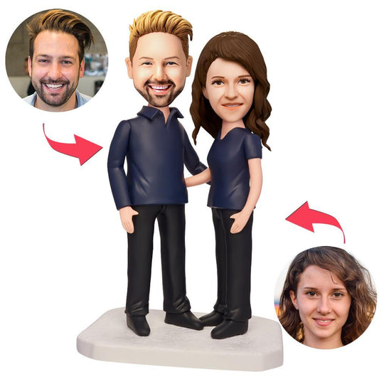 Personalised business-style couple bobbleheads in polymer clay wearing smart professional attire on an engraved base personalised with custom text, heads modelled from your photos