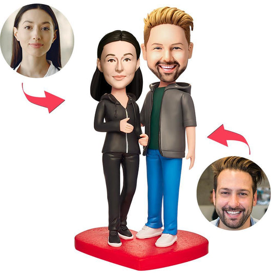 Personalised polymer clay couple bobbleheads in matching sportswear with engraved base, customised heads — ideal anniversary or sporting keepsake