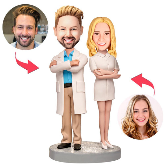 Pair of personalised polymer clay male doctor and female nurse bobbleheads with engraved text on the base — personalised doctor bobblehead and female nurse bobblehead gift