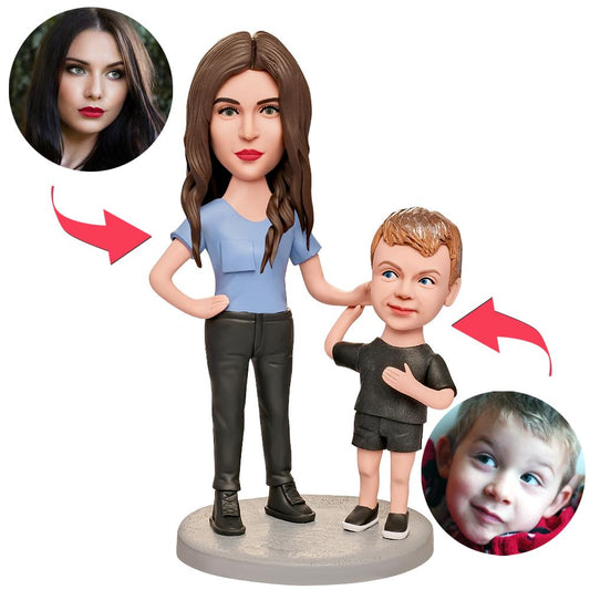 Personalised mum bobblehead grabbing child's ear, customised head matching hairstyle and facial features in polymer clay with engraved text — unique engraved bobblehead gift for mum