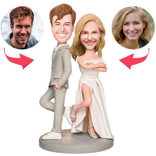 Custom wedding bobblehead couple for husband and wife — personalised polymer clay figures with engraved base, bride in white dress and groom in suit, ideal engraved wedding gift