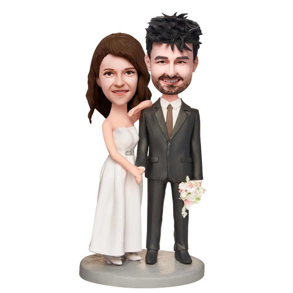 Personalised wedding couple bobblehead with engraved text on base, handcrafted polymer clay bride and groom figurines in classic standing pose, customisable heads and hairstyle options, unique wedding gift