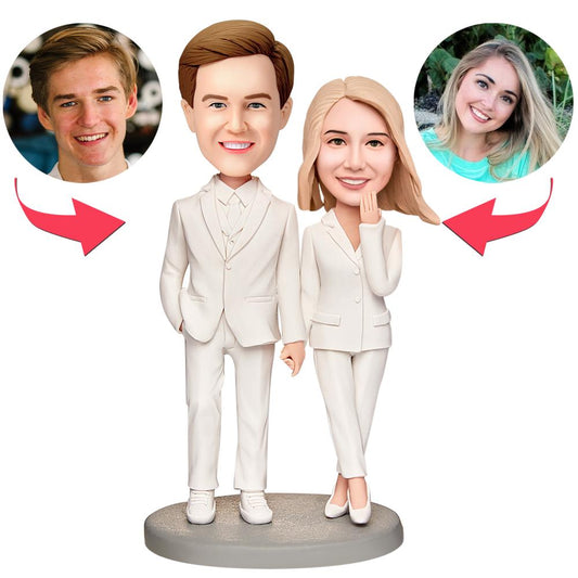 Personalised wedding bobblehead in white suit with engraved text on the base, handcrafted polymer clay keepsake with customised head likeness for bride or groom