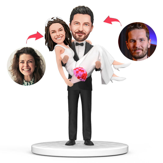 Carry Wife romantic wedding personalised bobblehead in polymer clay – groom carrying bride design with custom engraved name plaque, personalised wedding keepsake