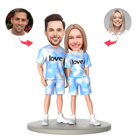 Blue and white gradient personalised couple bobblehead — handcrafted polymer clay couple with custom heads and engraved base, ideal wedding or anniversary keepsake