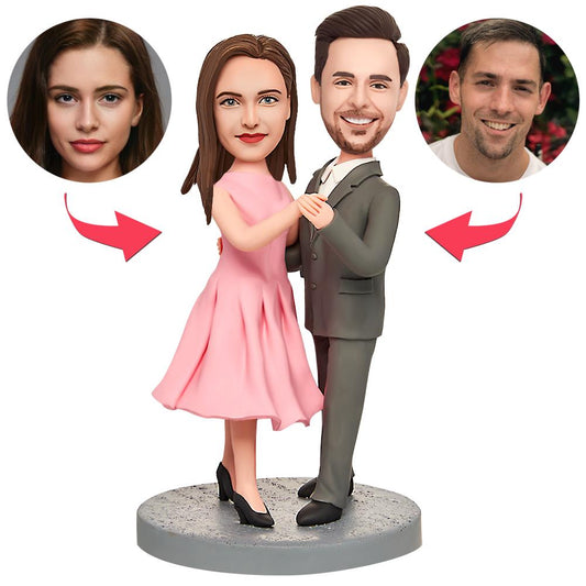 Personalised dancing couple bobblehead wearing pink dresses and black suits with engraved text on the base — custom wedding gift and anniversary keepsake (UK & Australia)