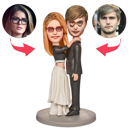 Personalised Halloween wedding bobblehead couple in polymer clay with engraved text on the base — customisable heads, expressions and hairstyles for a quirky wedding keepsake