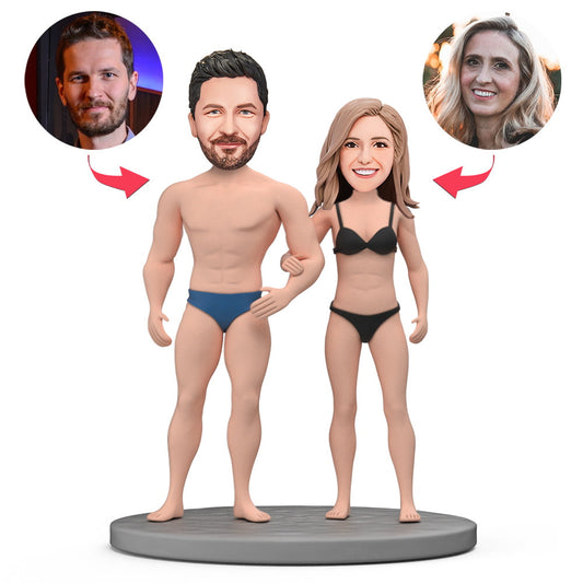 Hand-sculpted personalised bikini couple bobblehead in polymer clay with engraved text on the base — a bespoke Valentine’s gift and personalised bobblehead, ideal as a custom bobblehead couple for the UK and polymer clay bobblehead Australia.