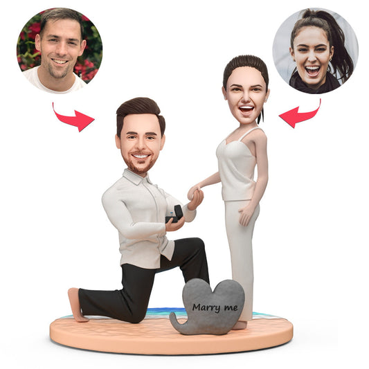 Personalised proposing couple on the beach bobblehead — polymer clay custom couple showing a kneeling proposal with engraved base for names or date, perfect beach proposal keepsake