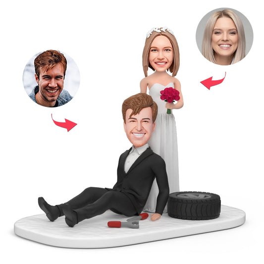Personalised groom and bride sitting tyre bobblehead with engraved base, polymer clay wedding keepsake featuring customised head likeness and hairstyle