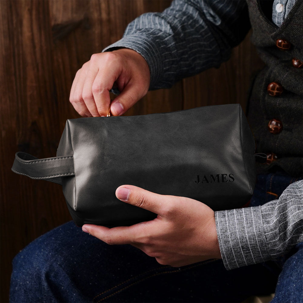 PU leather dopp kit side view with carry handle and secure zipper — personalised men's travel wash bag suitable for toiletries and shaving kit.