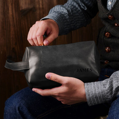 PU leather dopp kit side view with carry handle and secure zipper — personalised men's travel wash bag suitable for toiletries and shaving kit.