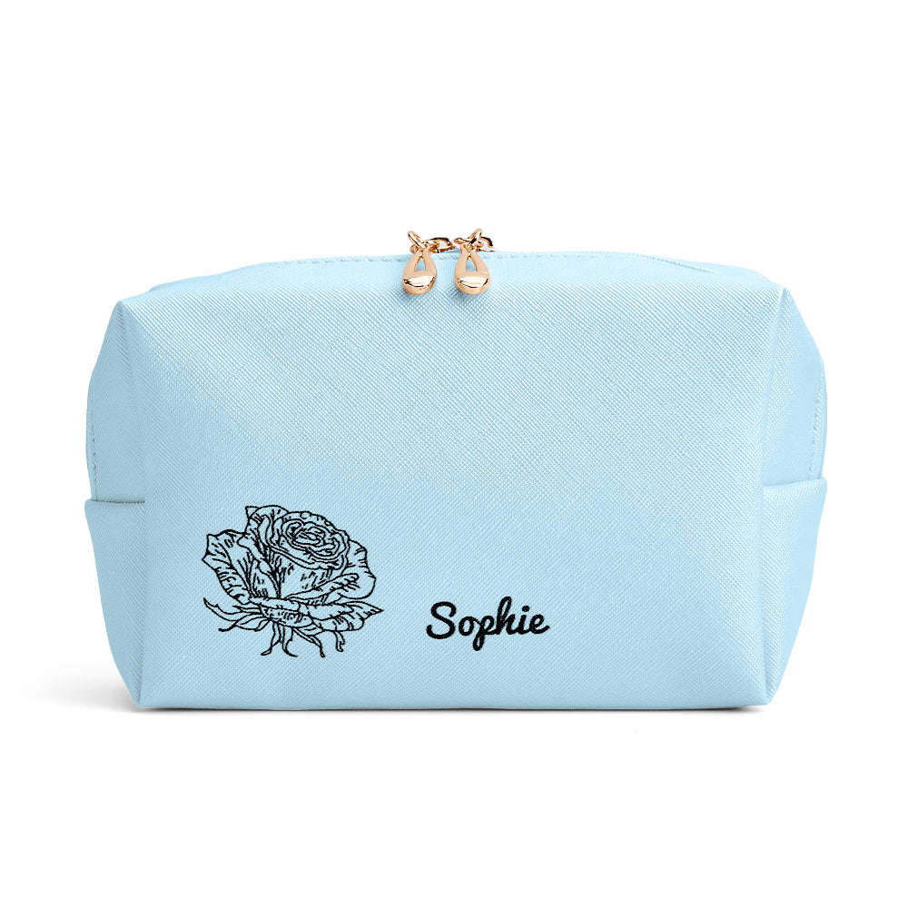 Lifestyle image of woman holding personalised birth flower cosmetic pouch — stylish, personalised gift for girlfriend, sister or mum