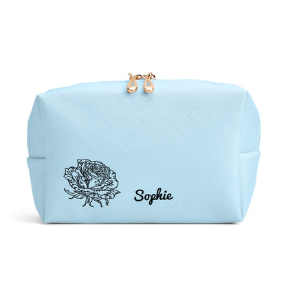 Lifestyle image of woman holding personalised birth flower cosmetic pouch — stylish, personalised gift for girlfriend, sister or mum