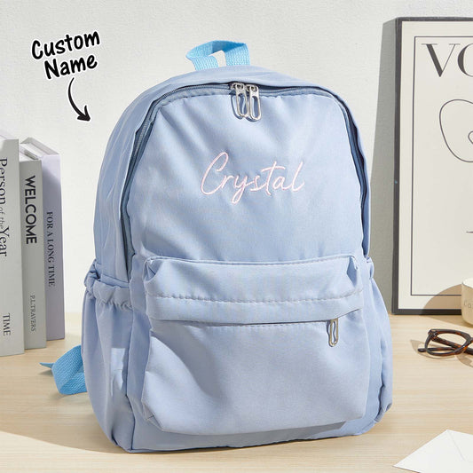 Front view of personalised embroidered name canvas backpack for kids showing custom name and main compartment, personalised school bag back to school gift